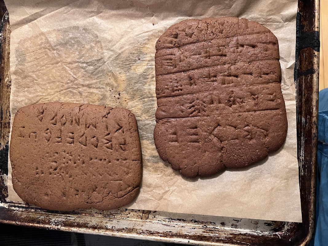 tablets made of gingerbread.  Some cuneiform and some roman alphabet are etched into the gingerbread.  The cuneiform is mostly gibberish but says "Ashurbanipal" at least once.