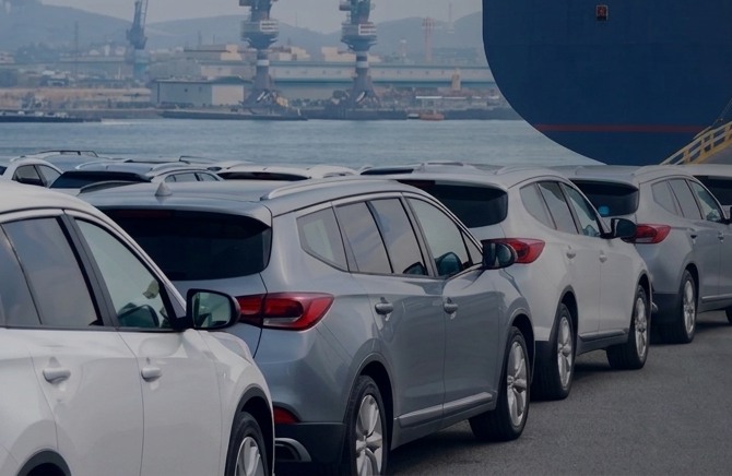 Vehicles lined up at a port for export shipment