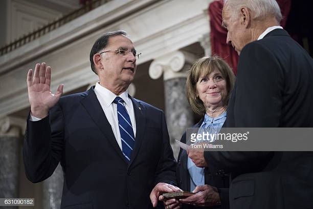 Sen. John Boozman, R-Ark., accompanied by his wife Cathy, takes the Senate oath during a ceremonial swearing-in ceremony on Capitol Hill in Washington