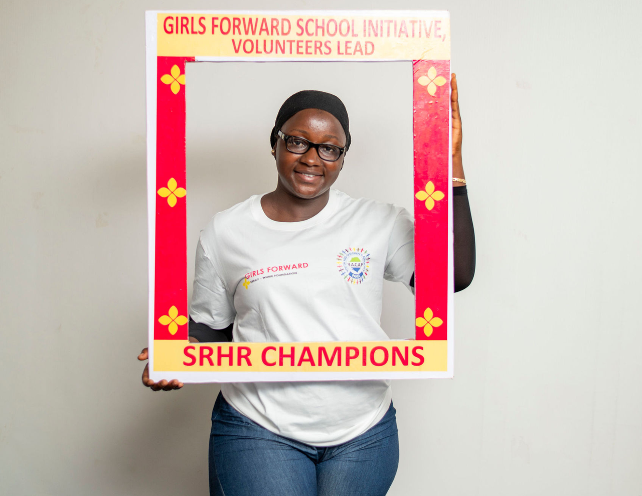 Volunteer nurse and mentors delivering health education to adolescent girls