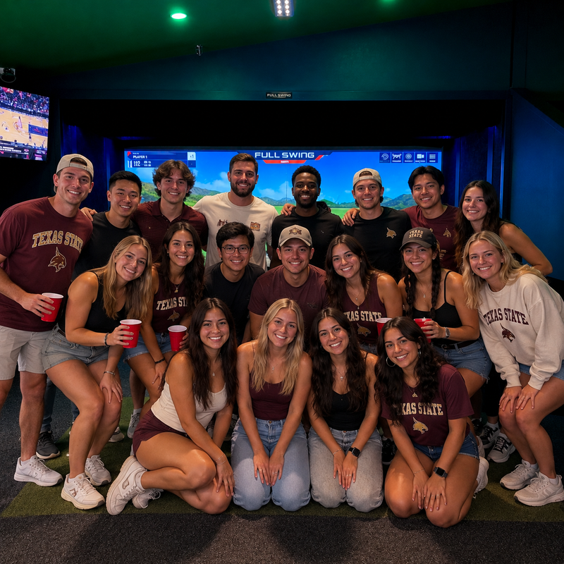 College group celebrating at the golf simulator
