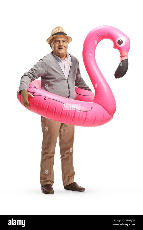 elderly-man-with-a-big-inflatable-flamingo-rubber-ring-isolated-on-white-background-2PHBJ74.jpg