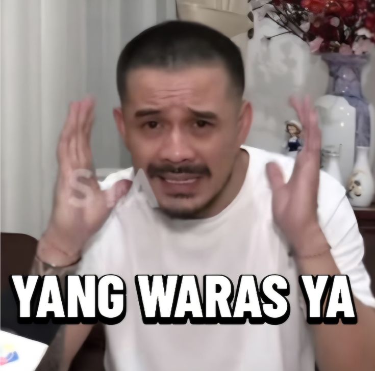 May include: Aerial view of a tropical island with a village, surrounded by turquoise water and a deep blue ocean. The island features white sand beaches, palm trees, and buildings with blue and red roofs. Wooden piers extend into the clear water.