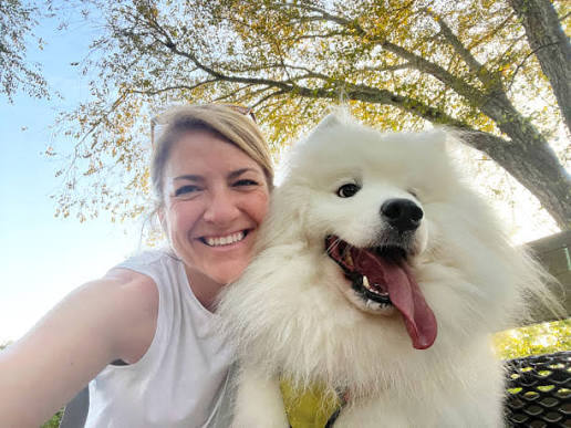 Pet owner with their pet during a grooming or at-home care moment