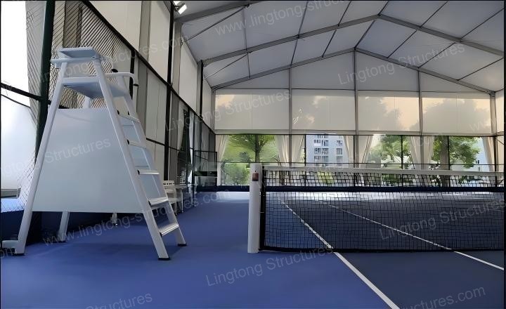Tennis court tent outdoor installation with spectators and competition setup