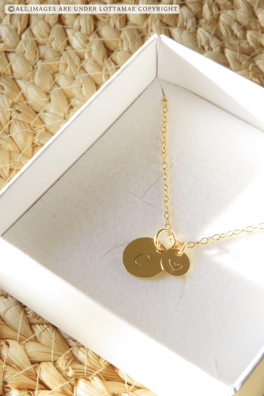 This dainty and personalizable disk necklace is the perfect way to show off your personality. Crafted from 925 sterling silver and 18k gold plated, this necklace is sure to turn heads wherever you go. The initial of your choice will be hand stamped onto the disk, making it a totally unique piece of jewelry that you can wear with pride. Whether you choose your own initial or a special memento of someone close to you, this necklace is a wonderful way to express who you are. Perfect for everyday wear, it will add a touch of elegance to any outfit. Add this beautiful and personalized piece of jewelry to your collection today!