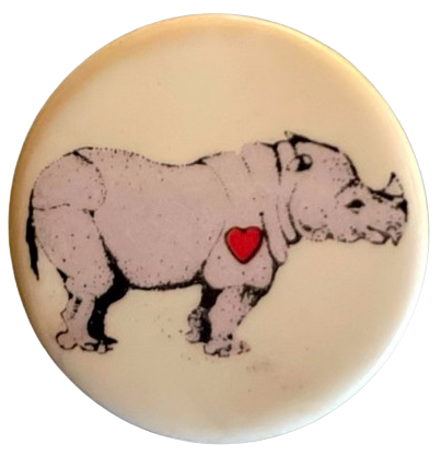 a pin with a rhino on it, and a little drawn heart where i assume its heart would be