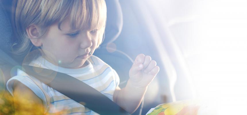 Child looking out car window