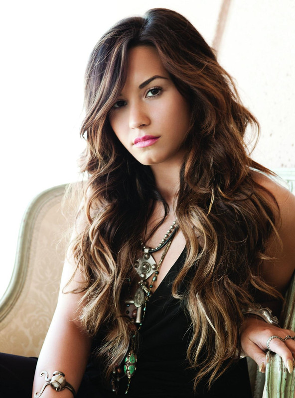 Demi Lovato  - 2024 Brown/Black hair & exotic hair style.
