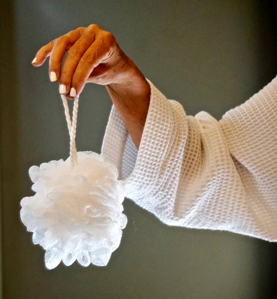 close-up-of-womans-manicured-hand-dangling-a-sponge-on-a-rope.jpg