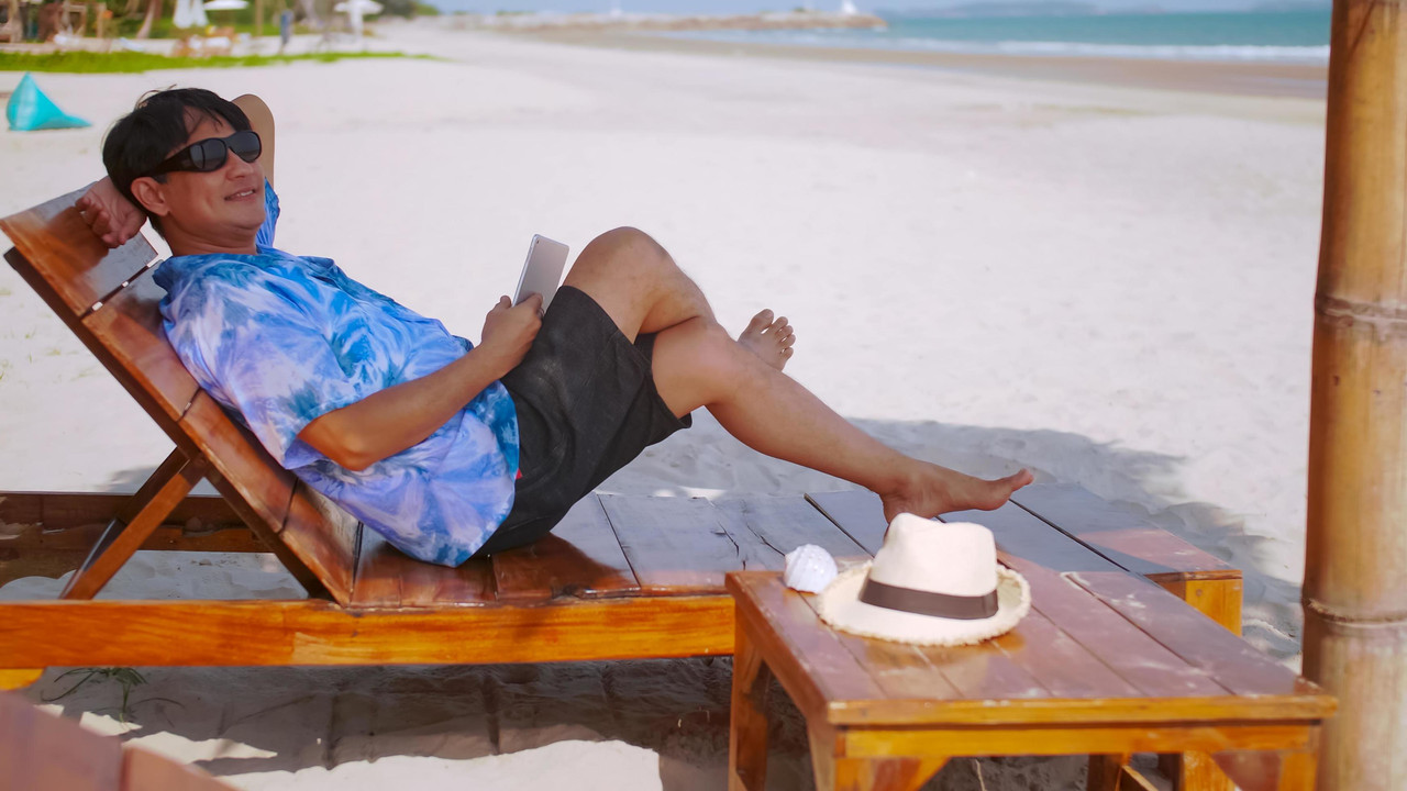 businessman spends his weekends relaxing at the beach senior asian man relaxing on the beach free ph