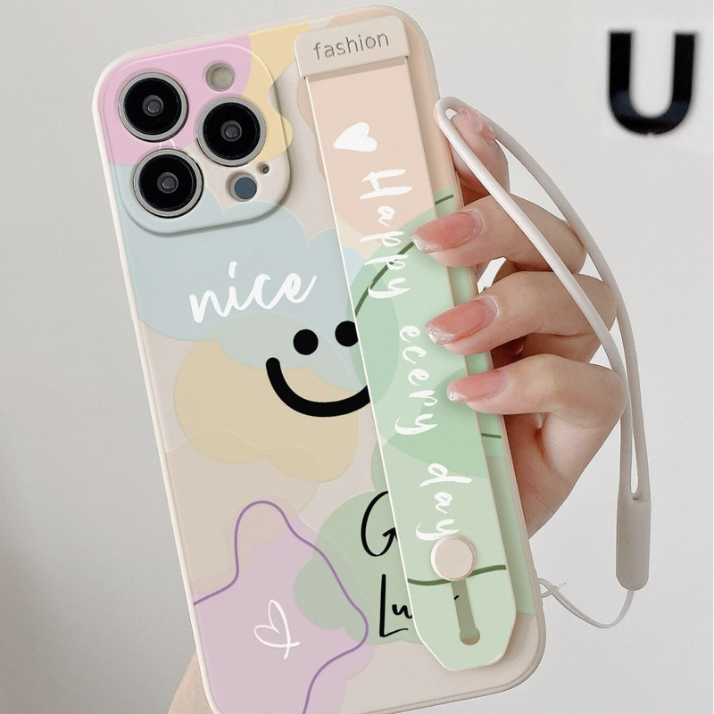 Foto de Funda con diseño de sonrisa. Incluye correa de mano.