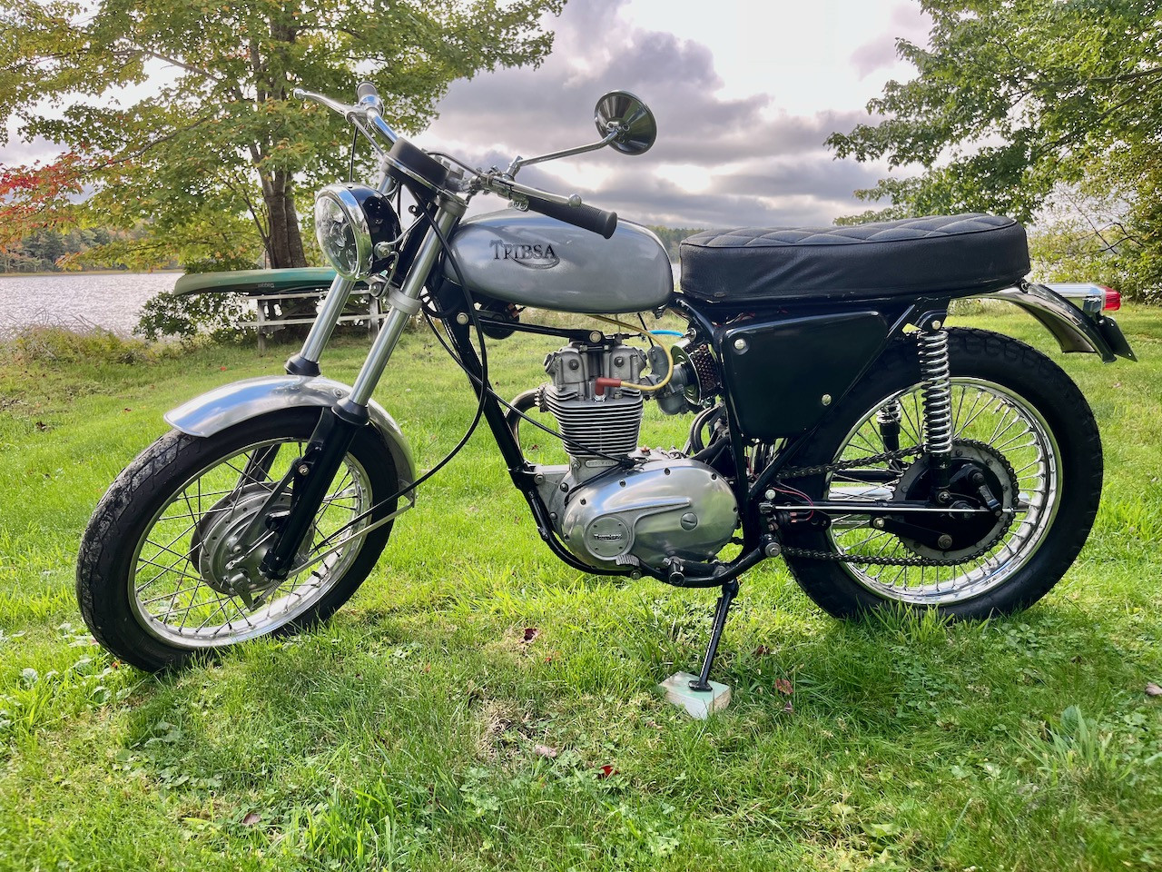 Tribsa repainted with decals left side in yard