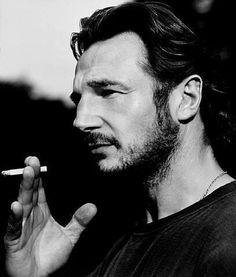 Liam Neeson smoking a cigarette (or weed)
