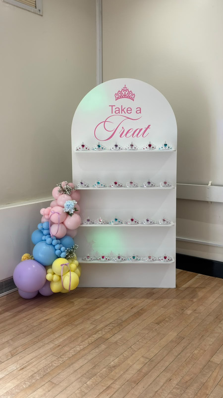Treat board with colourful balloons and tiaras