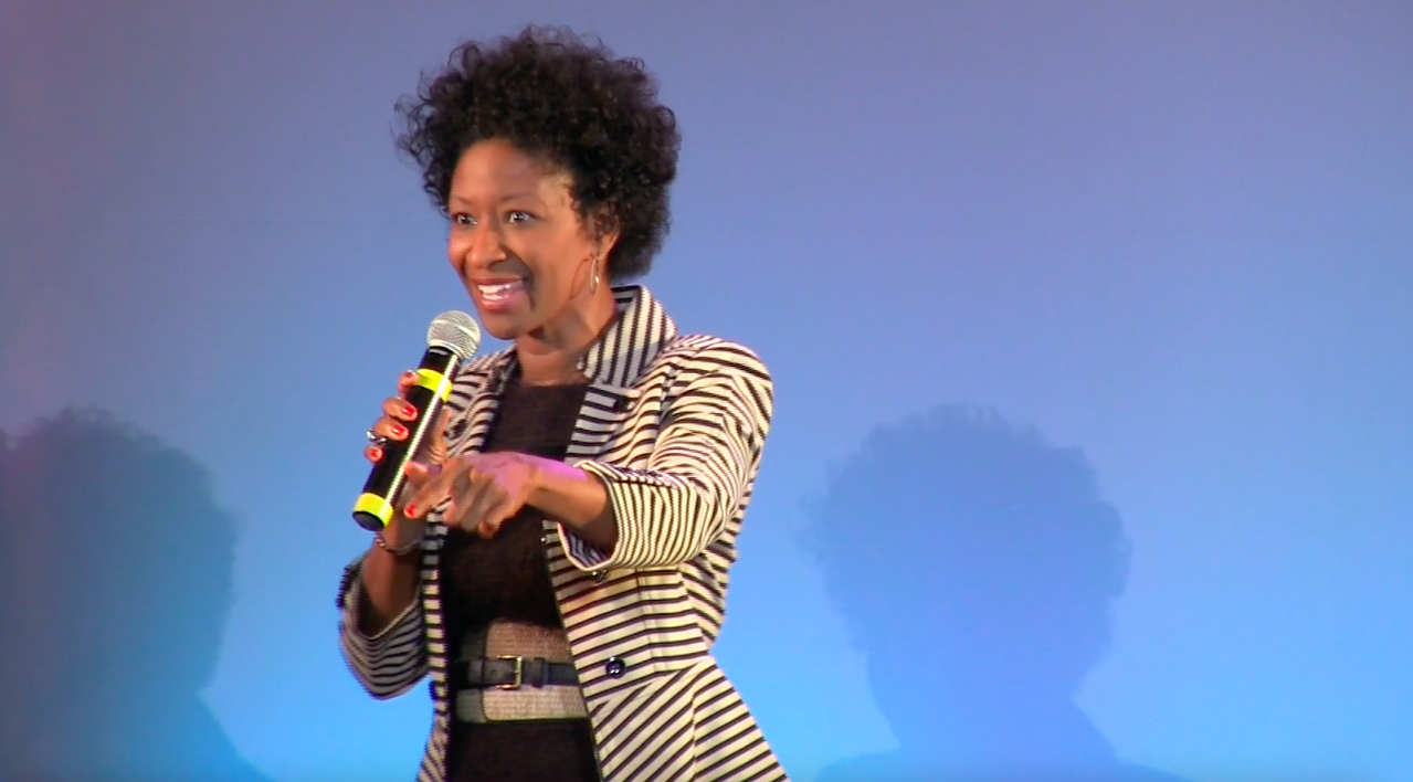 S. Renee Smith speaking on stage