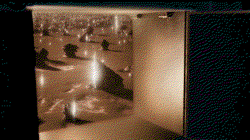 A dithered image of an open cabinet. Inside, there is a desert landscape dotted with shards of light.