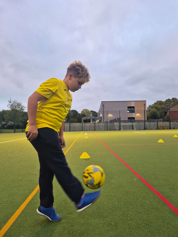 Young footballer practising ball control at a Constantine Football Club session