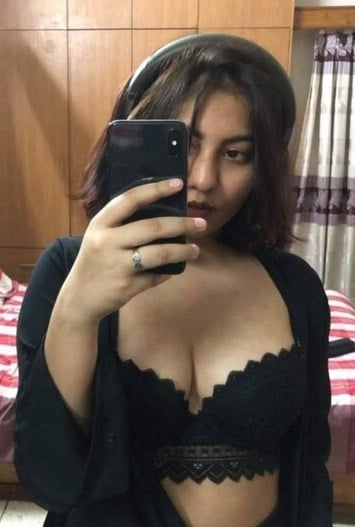 she is showing deep cleavage in a black bra