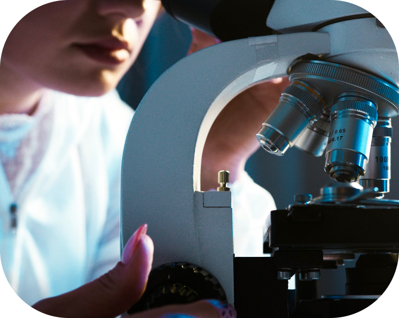 Scientist using a microscope