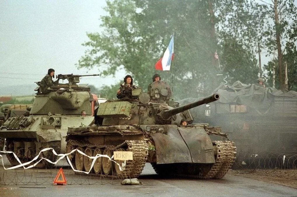 yugoslavian-m36-and-t-55a-passing-by-an-american-m1-abrams-v0-5ii8zsv2pw9e1.webp