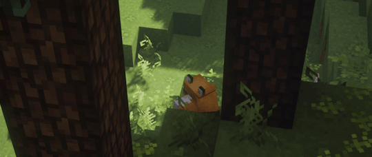 A gif of a minecraft forest seem from above, with two trees and a red fox sleeping under one of them, in a shaded area cast by the trees. it's daytime and some ferns and grasses are moving, as if in a breeze.