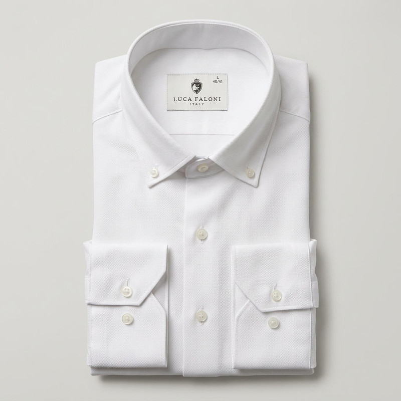 Man in a crisp white linen shirt with mandarin collar in outdoor setting
