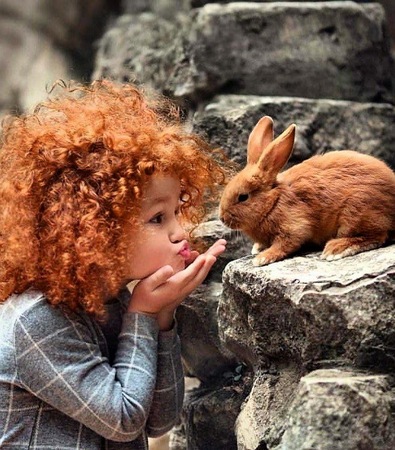 Redhead-kisses-to-rabbit