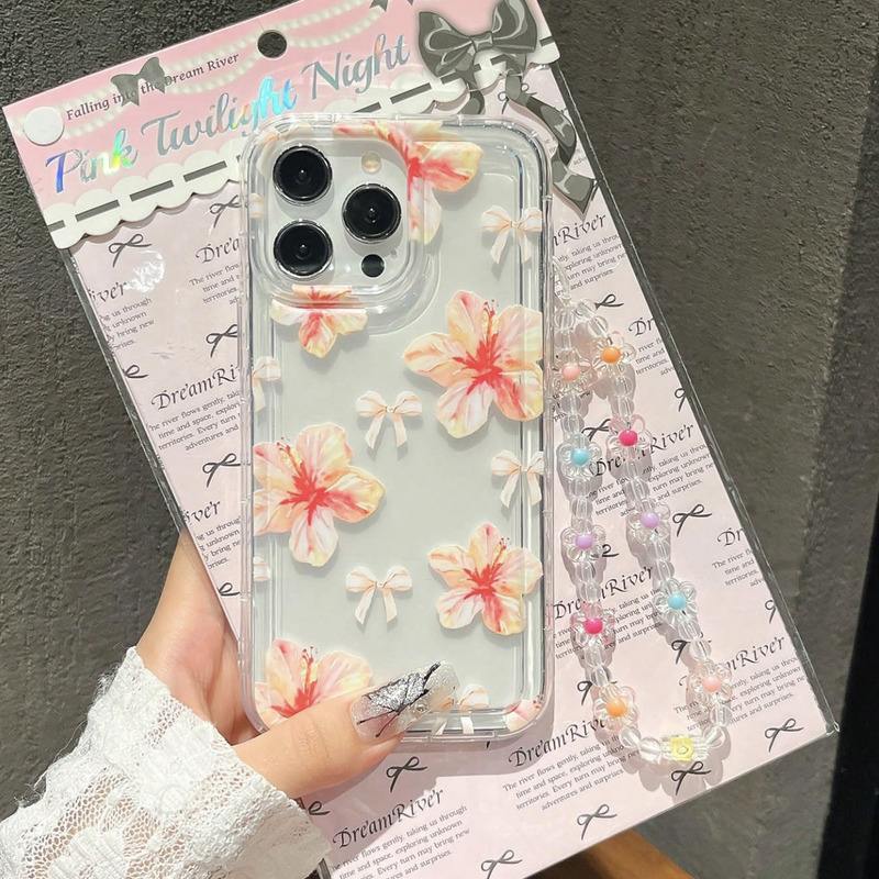 Foto de Funda transparente estampado floral. Incluye correa de mano.