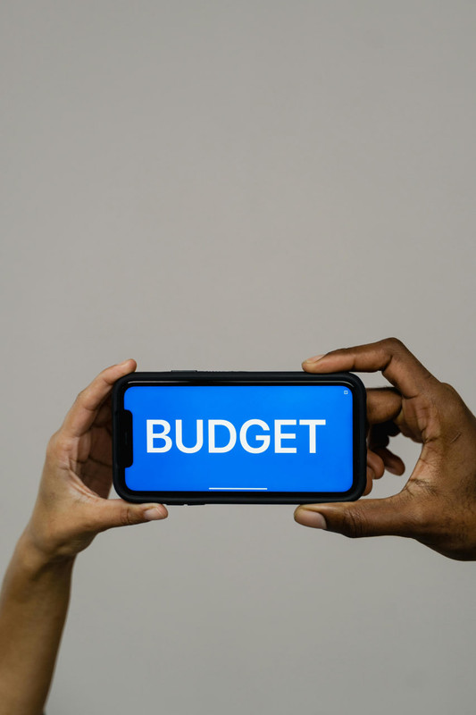 A smartphone screen with the word Budget in bold letters
