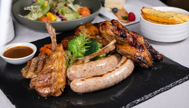 Lean meat platter with sauce, potato veggies and some salad on the side