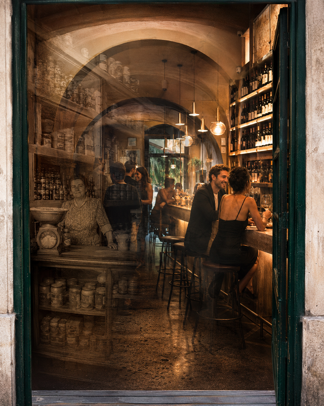 A changed New Orleans interior where the present life of a wine bar overlaps with the remembered grocery