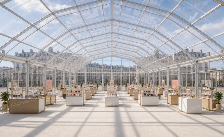 Multi-faceted clear-top event tent interior with natural daylight and column-free space