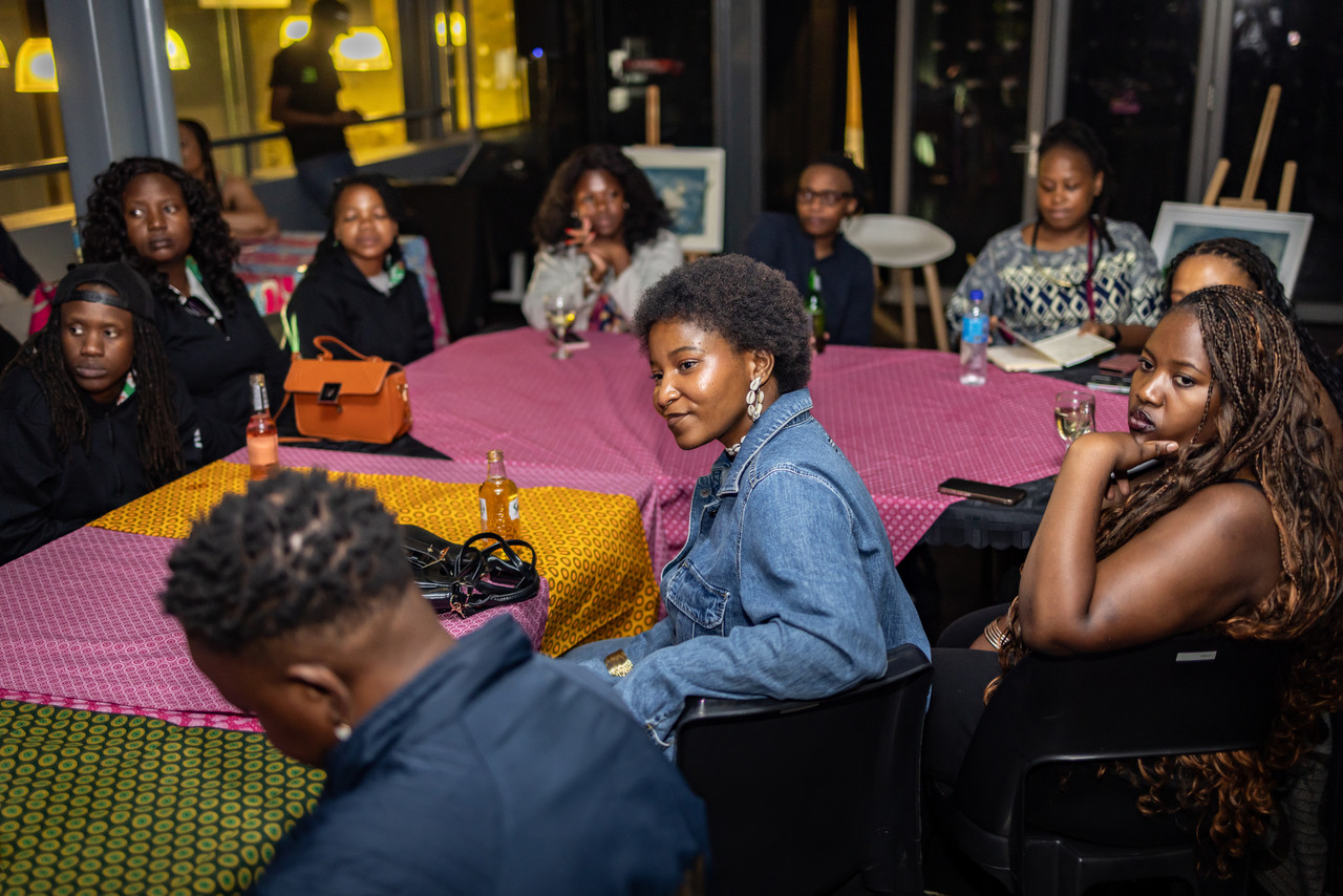 Samukelisiwe Dube sitting and smiling