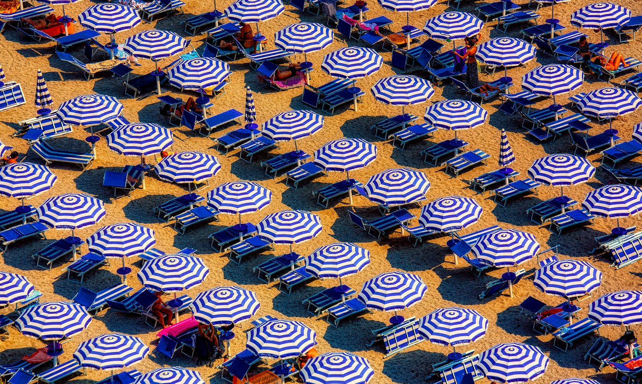 Canva-Aerial-View-of-Blue-and-White-Open-Cottages-at-the-Beach.jpg