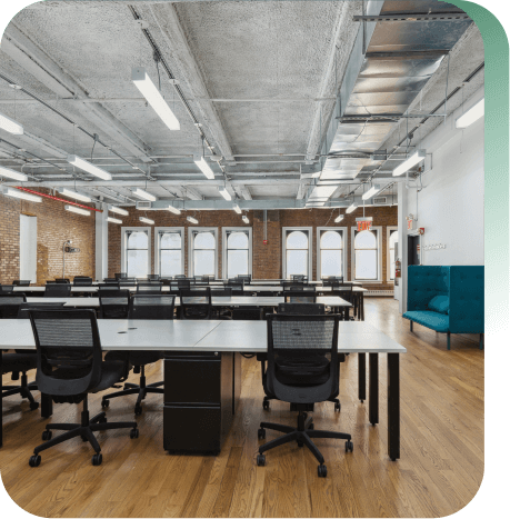 Very large floor with multiple rows of desks and work areas.