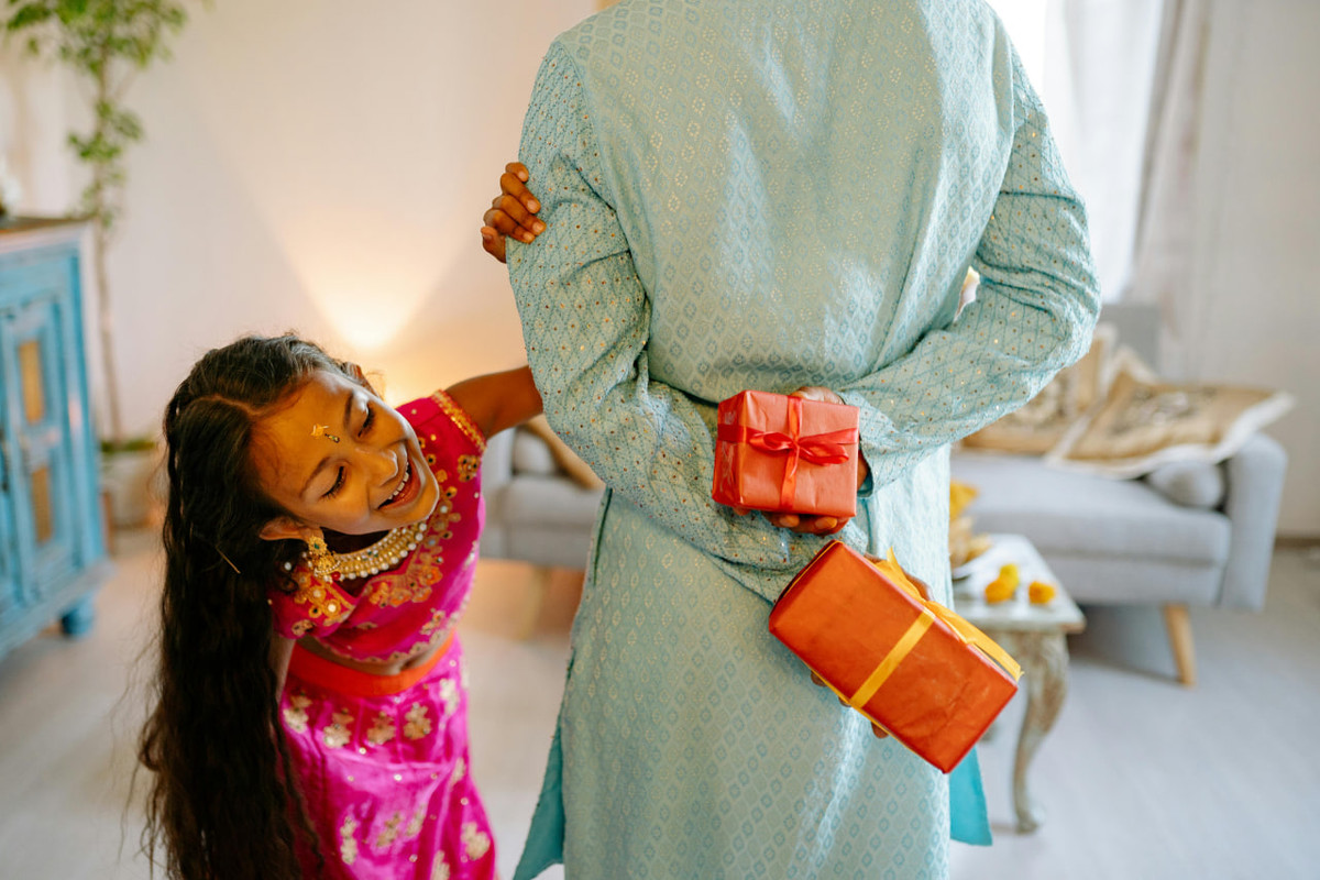 A father giving a present to his daughter
