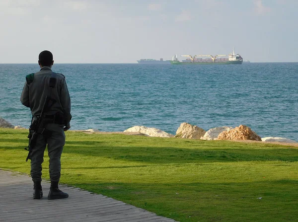 https://i.postimg.cc/W4KrzQY8/depositphotos-220608770-stock-photo-israel-soldier-watching-sea-evening.webp