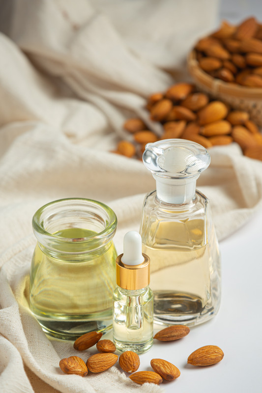 almond-oil-bottle-white-background
