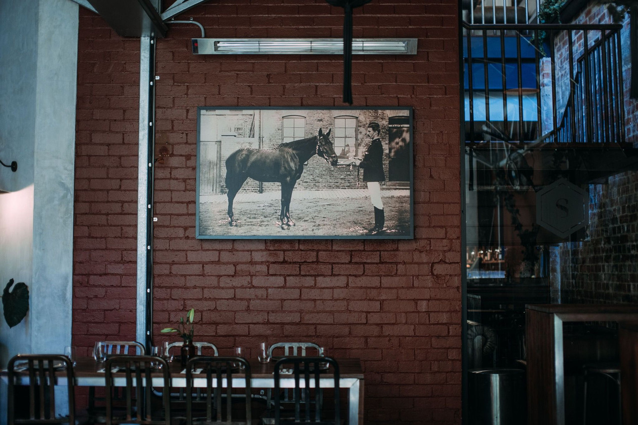 Architectural interior detail with brick and artwork