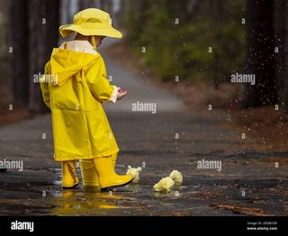 child-enjoying-the-rain-in-his-galoshes-2-DGB1-D9.jpg