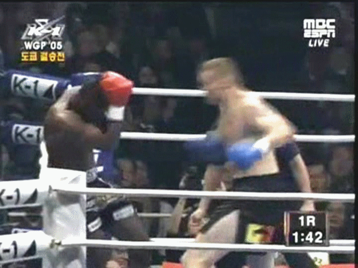 Remy_Bonjasky_taking_a_hard_left_liverpunch_and_is_counted_out