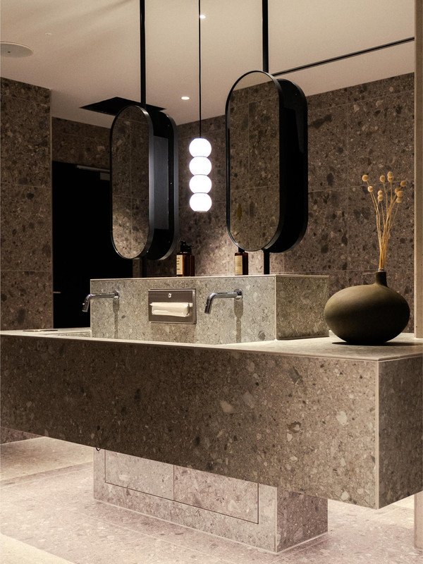 Compact interior lighting at Coreum Hotel showing a layered approach within a smaller architectural space