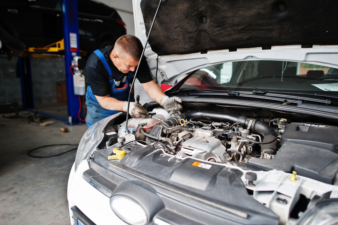 car-repair-maintenance-theme-mechanic-uniform-working-auto-service-checking-engine (1) (1)