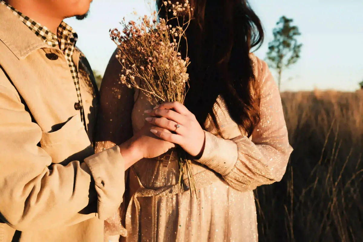 Boy giving flower to spouse - bonding trip