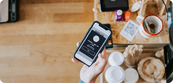 Phone over table with coffee