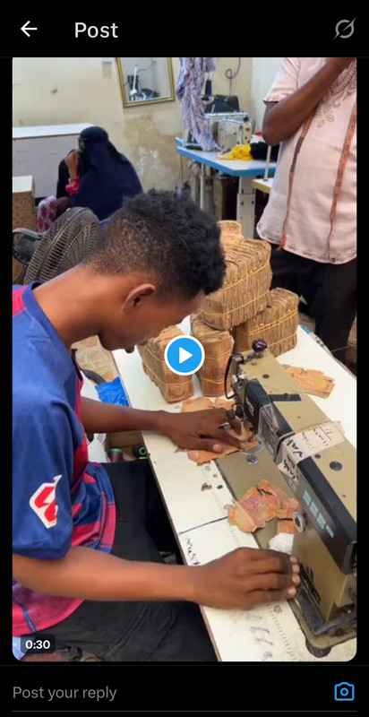 Money being stitch together by tailor