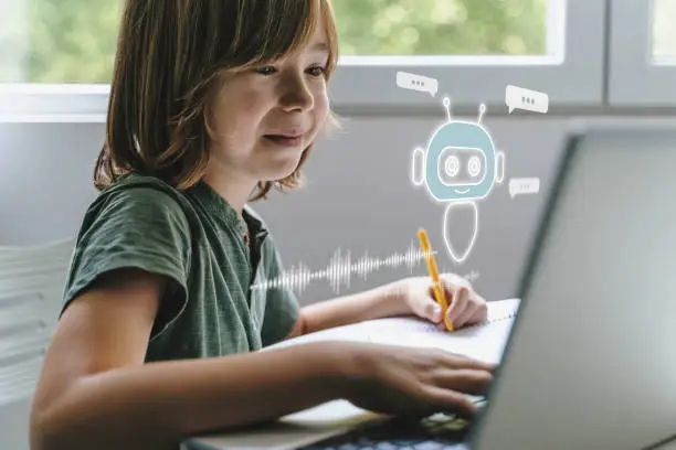 Young student learning artificial intelligence online using a laptop at home.