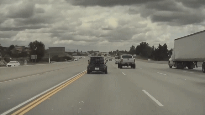 INSANE-Car-Crash-caught-on-Tesla-Cam-Kia-Soul-flying-through-air-1.gif