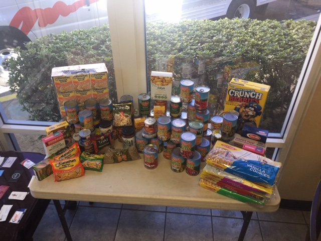 A display of food collected for the food drive at StaxUP Storage in Murrieta, CA.